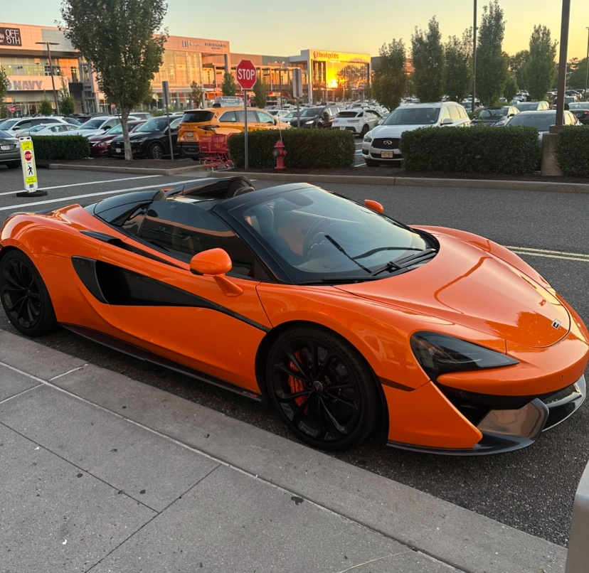 Orange McLaren supercar with elite reflective finish